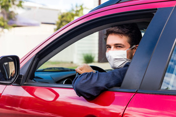 Young driver with face mask