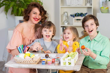 Preparations for Easter celebration with painting eggs and entertaining with family