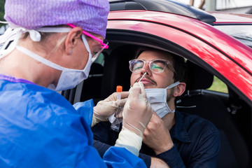 Doctor taking a nasal swab test