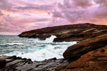 Landscape of hawaiian rocky shoreline with beautiful sky