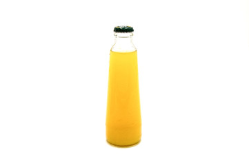 Close up view of fresh pineapple juice in glass bottle