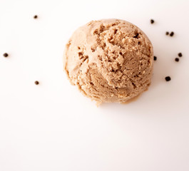Vegan oatmeal milk ice cream ball with chocolate chips on a light background with space for text. Top view. Flat lay