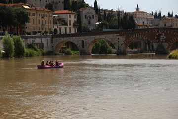 Verona - Adige panorama and rafts on the Adige.