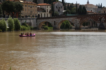 Verona - Adige panorama and rafts on the Adige.