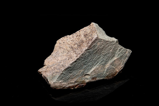 Zeolite natural raw stones on black background. Macro shot