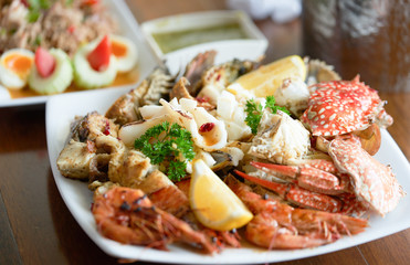 seafood on plate with spocy tasty dipping sauce