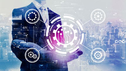 Automation concept with businessman on a city background