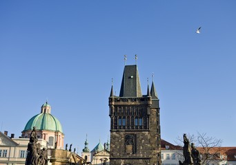 Fototapeta premium View of the Charles Bridge Tower and the statues on the Charles Bridge (Prague, Czech Republic, Europe)