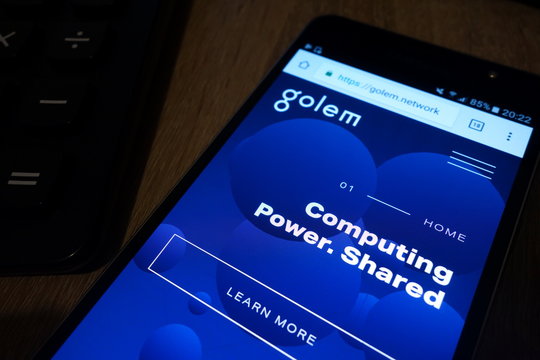 KONSKIE, POLAND - MAY 07, 2018: Smartphone with Golem crypto currency homepage golem.network displayed lying on desk