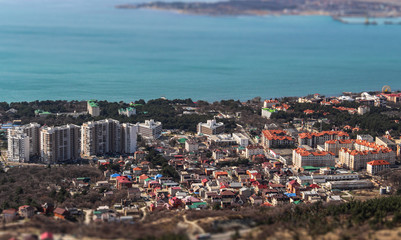 Gelendzhik, Black sea coast, creative idea with an effect of blurring and miniatures of buildings. Tilt-shift effect