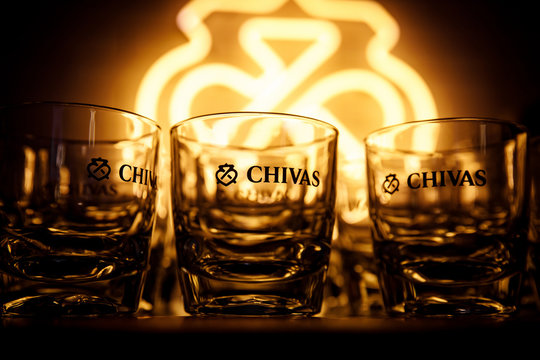 Minsk, Belarus - 19.01.2019: A row of Chivas whiskey glasses.