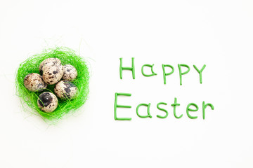 Easter holiday, a nest with quail eggs on a white background