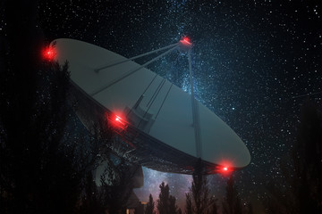 Radio telescope, a large satellite dish against the night sky tracks the stars. Technology concept,...