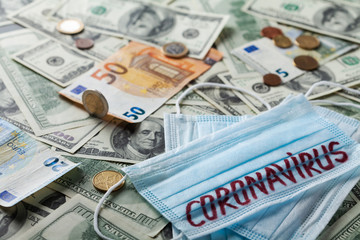 Medical face mask and money, world coronavirus epidemic and economic losses concept.
