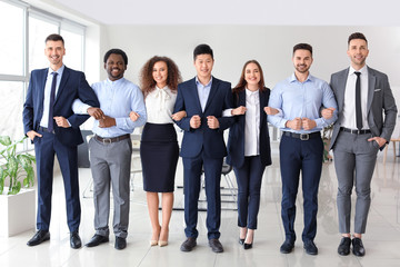 Obraz premium Group of business people in office. Unity concept