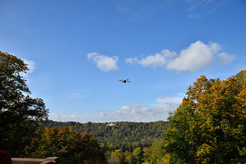 black flying drone in sky