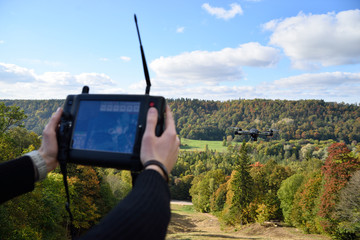 black flying drone in sky