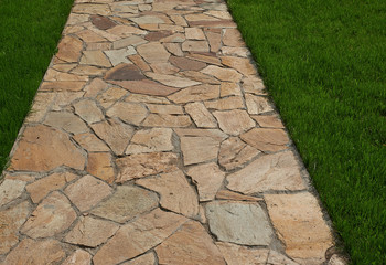 Stone pathway in garden. Stone path texture. 