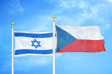 Israel and Czech Republic two flags on flagpoles and blue cloudy sky