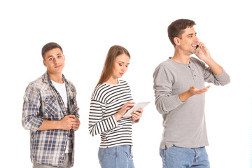Obraz premium Young people waiting in line on white background