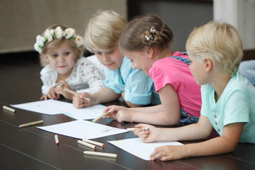 Fototapeta na wymiar Cute little children drawing at home
