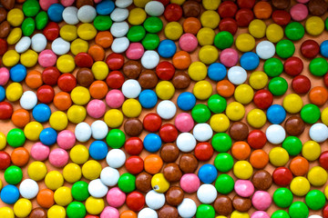 Background of sweets, chocolates of different colors