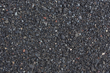 A background of black vulcanic sand