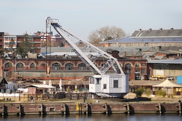 Old Crane in the Harbor in the Hanseatic City of Lübeck (Luebeck) – Germany