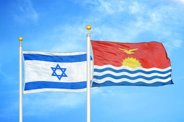 Israel and Kiribati two flags on flagpoles and blue cloudy sky