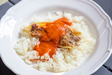 pepper filled with minced meat with tomato sauce and rice