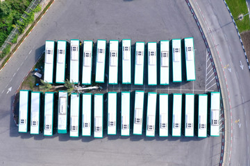 Corona Virus days, Bus terminal at full capacity of parked Buses due to Government lockdown guidelines, aerial view.