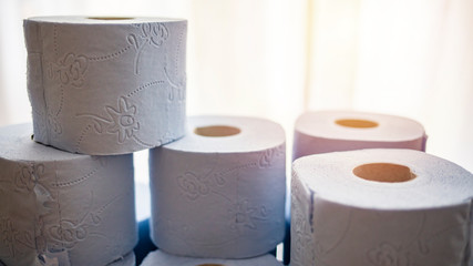 Many toilet paper rolls at home of hoarder hoarding amidst panic buying for corona virus outbreak shortage. Pyramid of Toilet paper roll. Concept of lack of toilet paper in stores due to coronavirus