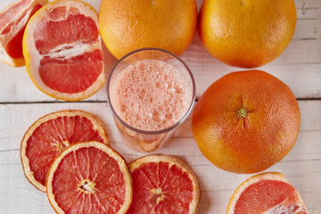Fototapeta na wymiar grapefruit juice on the light background