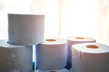 Lots of toilet paper rolls. Soft hygienic paper. Close up. Close up toilet paper roll pyramide. Concept of lack of toilet paper in stores due to coronavirus, Covid-19. Hygiene, panic.