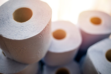 Many toilet paper rolls at home of hoarder hoarding amidst panic buying for corona virus outbreak shortage. Toilet paper rolls bathroom tissue hoarding on store shelf