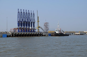 Fototapeta premium Natural gas and crude oil pipeline. Floating fuel station located near the coast to supply fuel to the ships in Mumbai, India
