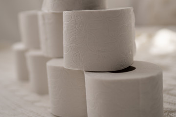 stack of new roll of white toilet paper close up 