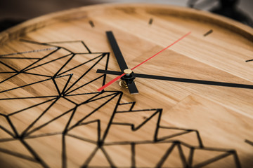 Round eco clock made of wood and epoxy. The subject of interior in your home. Natural handmade tree. Clock on the background.