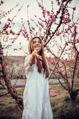 Portrait of a girl in a flower field during sunset