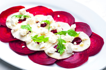 fresh beetroot and apple salad with fresh goat cheese and arugula