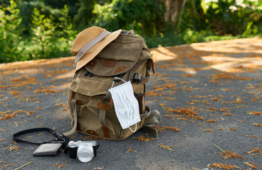                  Prop suitcase with Corona mask with camera and purse                                  