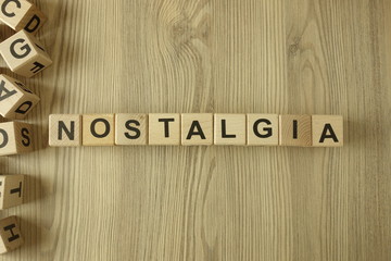 Word nostalgia from wooden blocks - obrazy, fototapety, plakaty