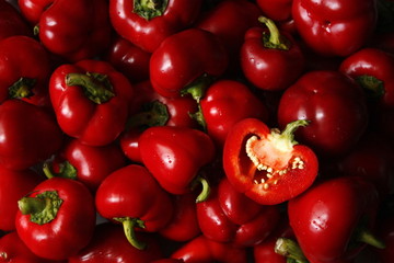 Macro photo of lots of red paprica. Texture or pattern of fresh ripe vegetables