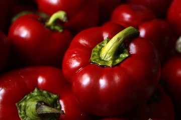 Macro photo of lots of red paprica. Texture or pattern of fresh ripe vegetables