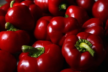 Macro photo of lots of red paprica. Texture or pattern of fresh ripe vegetables