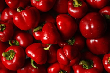 Macro photo of lots of red paprica. Texture or pattern of fresh ripe vegetables