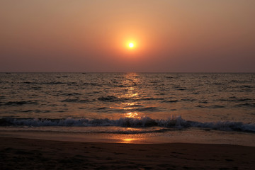 Obraz na płótnie Canvas Sunset at Candolim Beach, North Goa, India