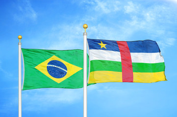 Brazil and Central African Republic two flags on flagpoles and blue cloudy sky