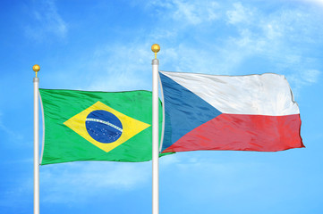 Brazil and Czech Republic two flags on flagpoles and blue cloudy sky