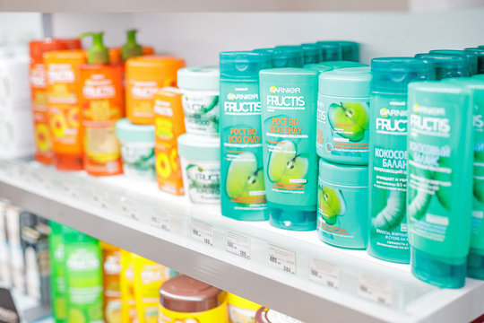 14 March 2020, Ufa, Russia: Shampoos balms and other cosmetic products of Garnier Fructis company on the counter of a household chemicals store